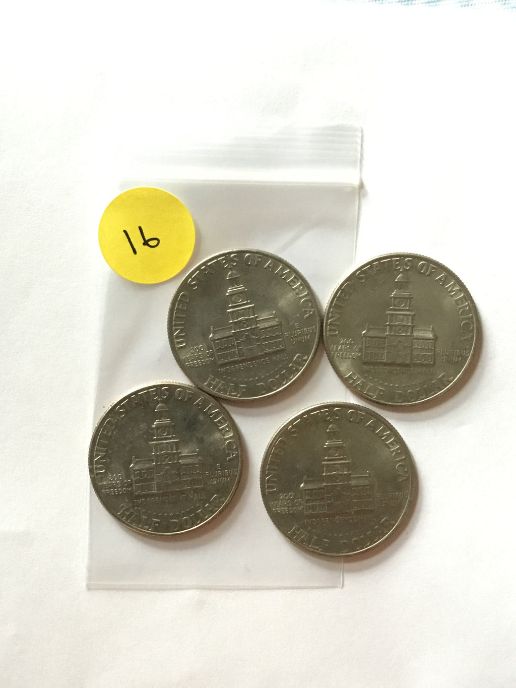 Four 1776-1976 Kennedy Bicentennial half dollars, reverse detail, LVC-016 Lot A
